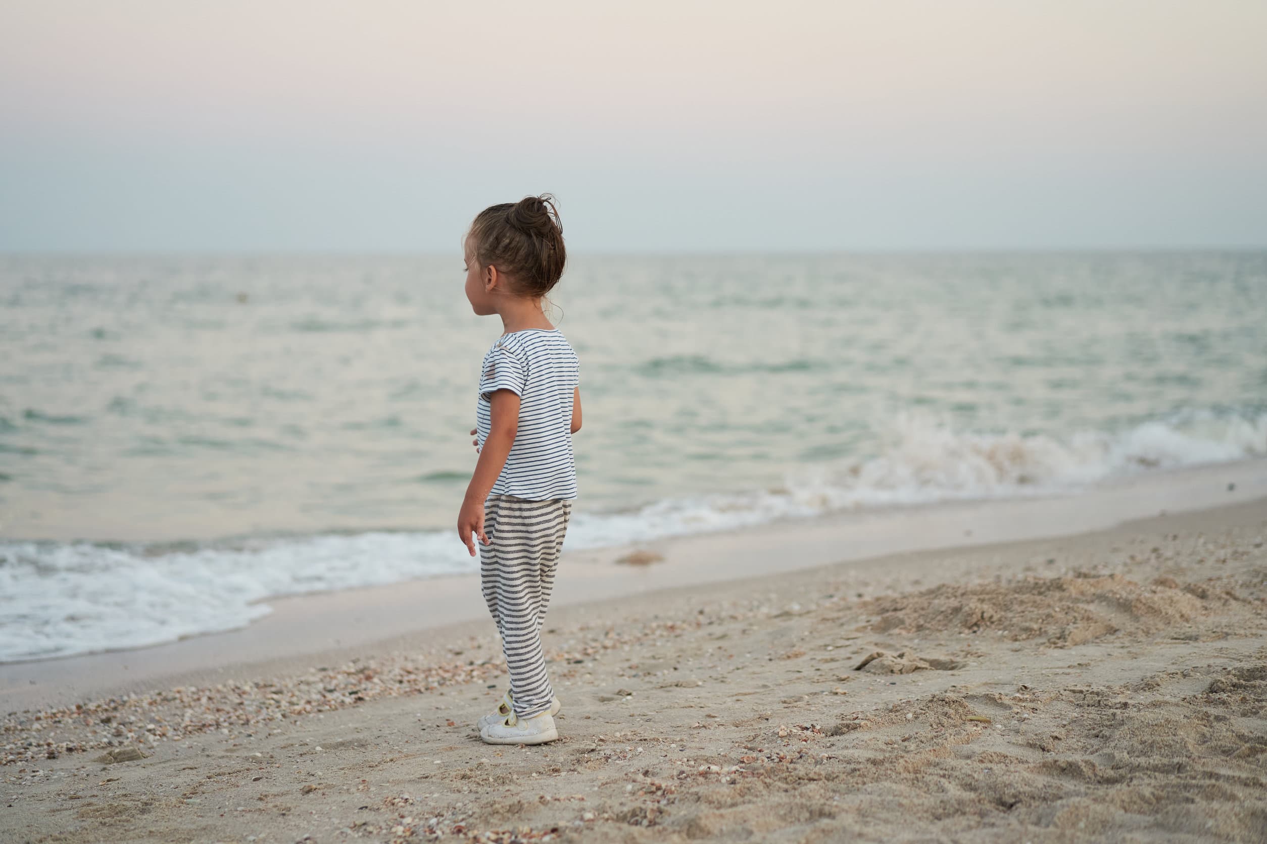 Child playing sand beach