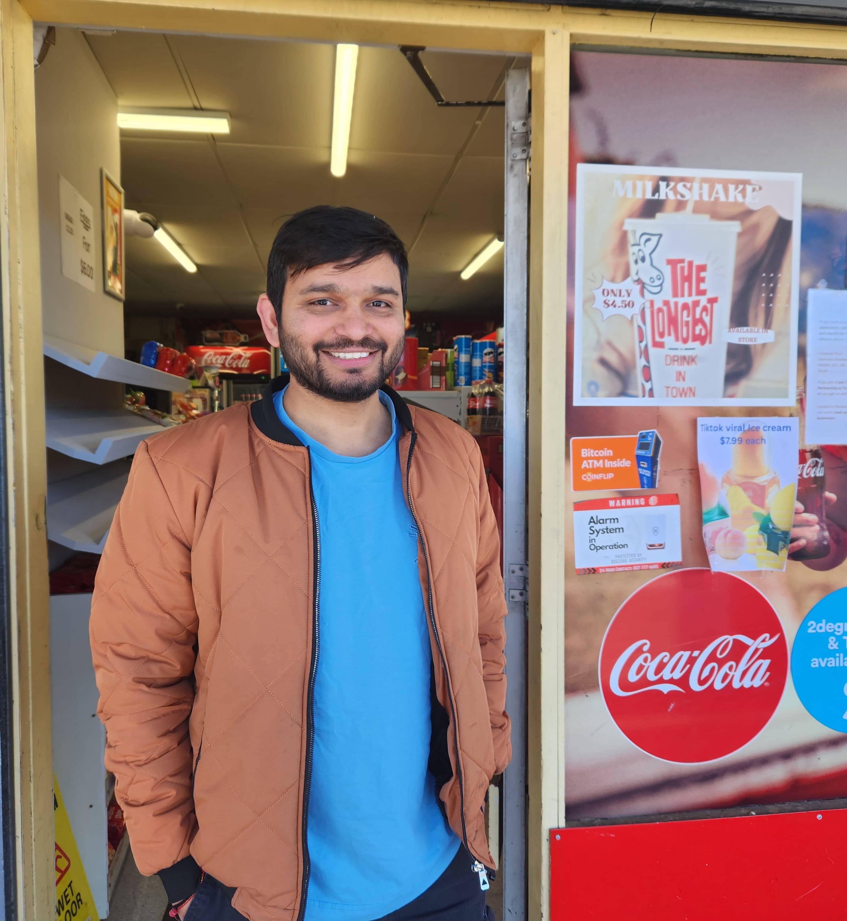 A picture of dairy owner John Patel, smiling.