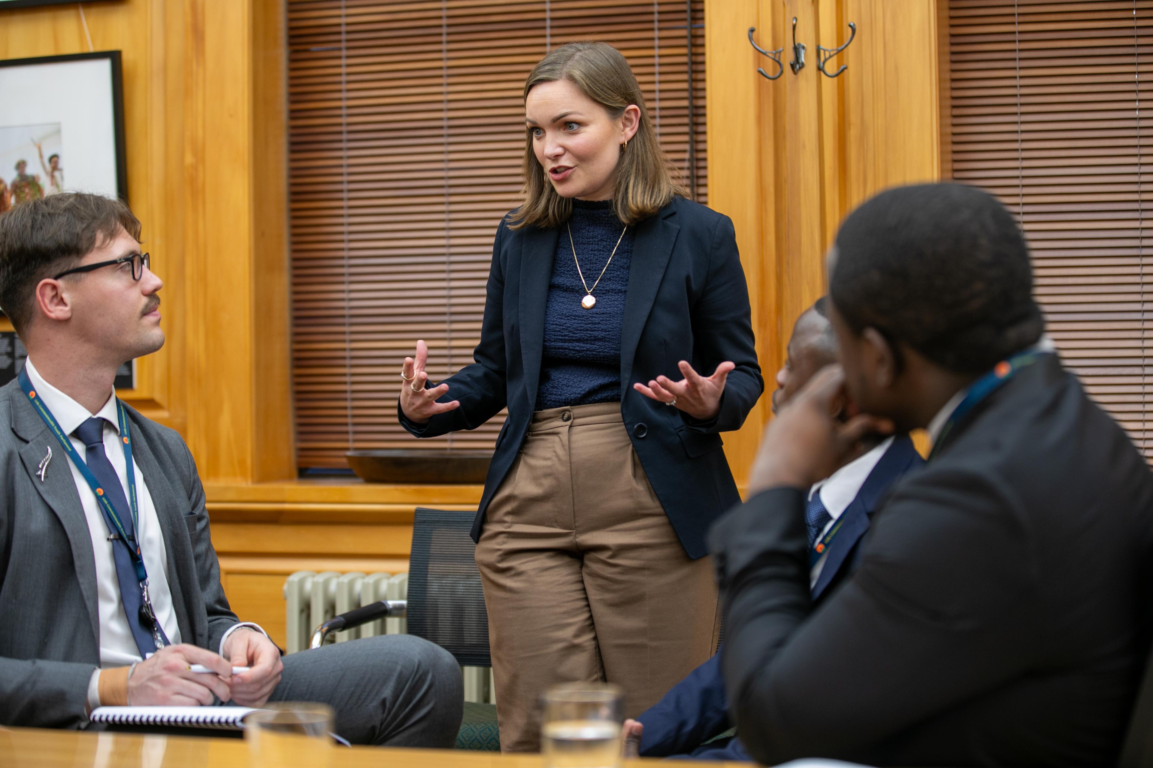 National MP Katie Nimmon offers her expertise to delegates during a committee session of the Commonwealth Youth Parliament.