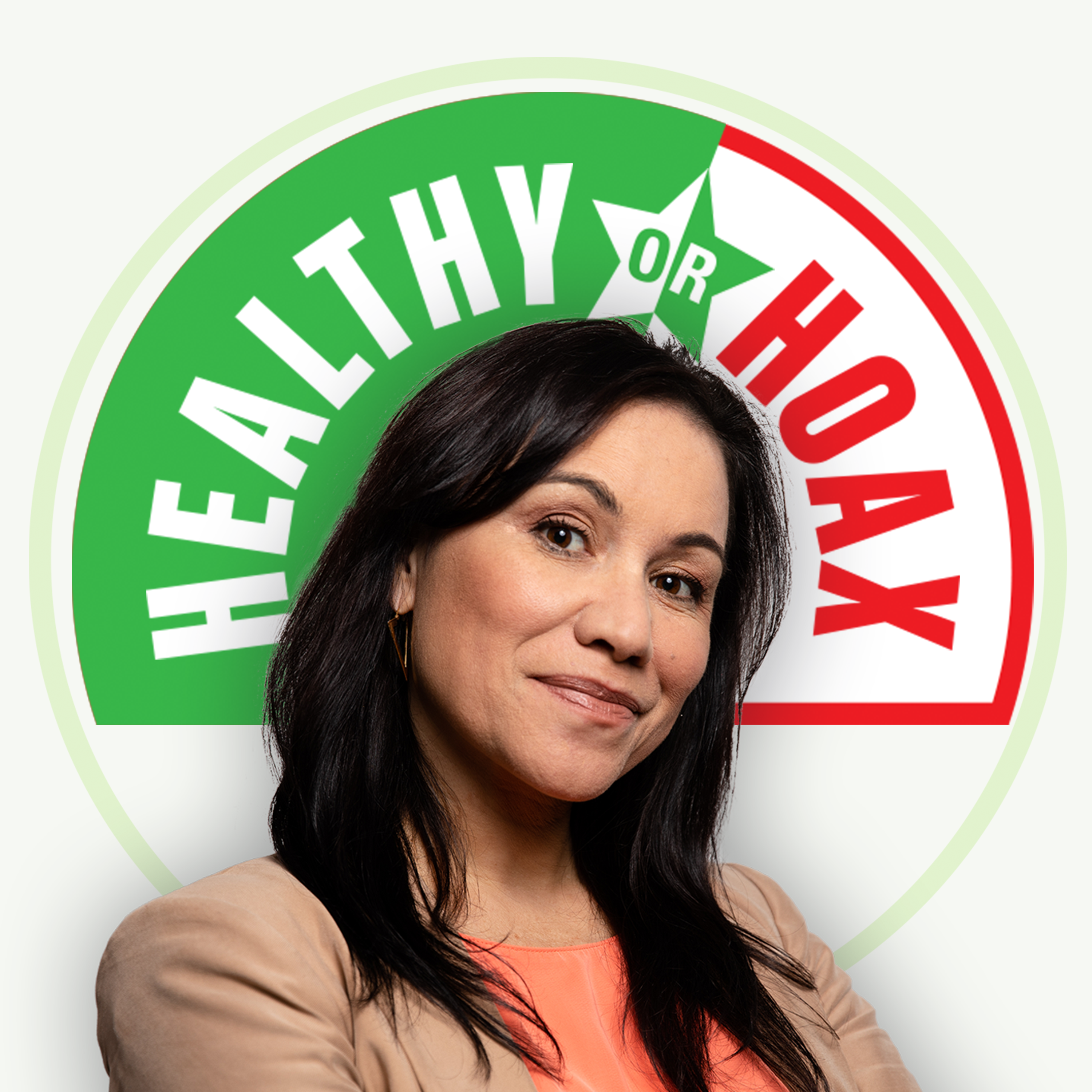 A woman with long dark hair and a neutral expression stands in front of a circular RNZ logo divided into green and red sections with 'HEALTHY' on the green side, 'HOAX' on the red side, and 'OR' in the middle. The woman is wearing a peach-colored blouse and a beige jacket.