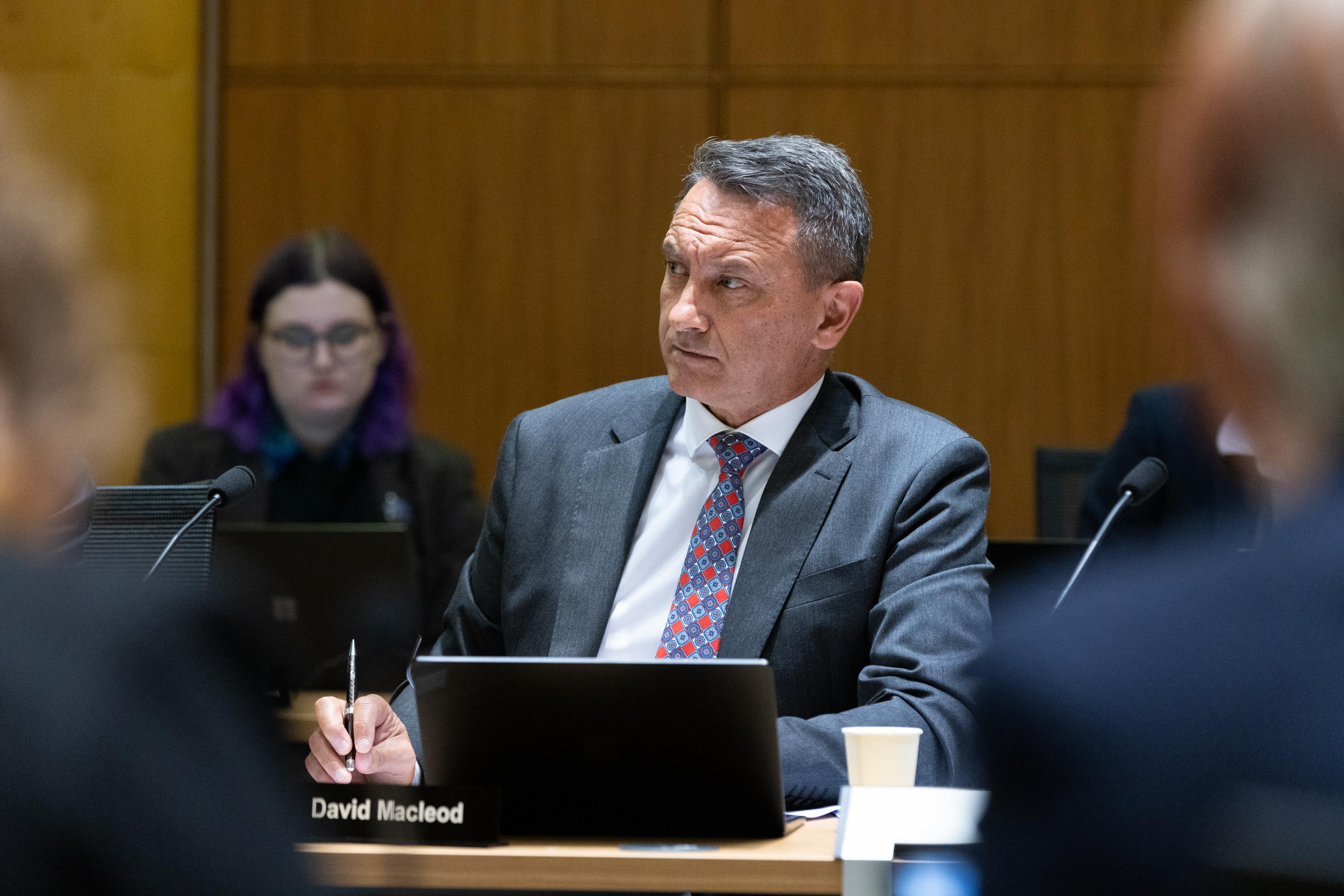 National Party MP David McLeod listening to evidence in select committee.