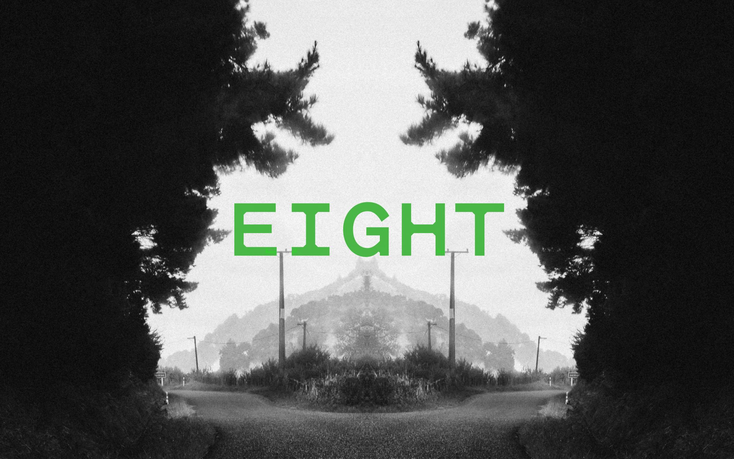 Podcast episode image for the 'Mr Lyttle Meets Mr Big' podcast. A moody black and white photograph of a rural road is mirrored vertically creating a Rorschach like effect with the episode number 'EIGHT' overlaid in vibrant green.