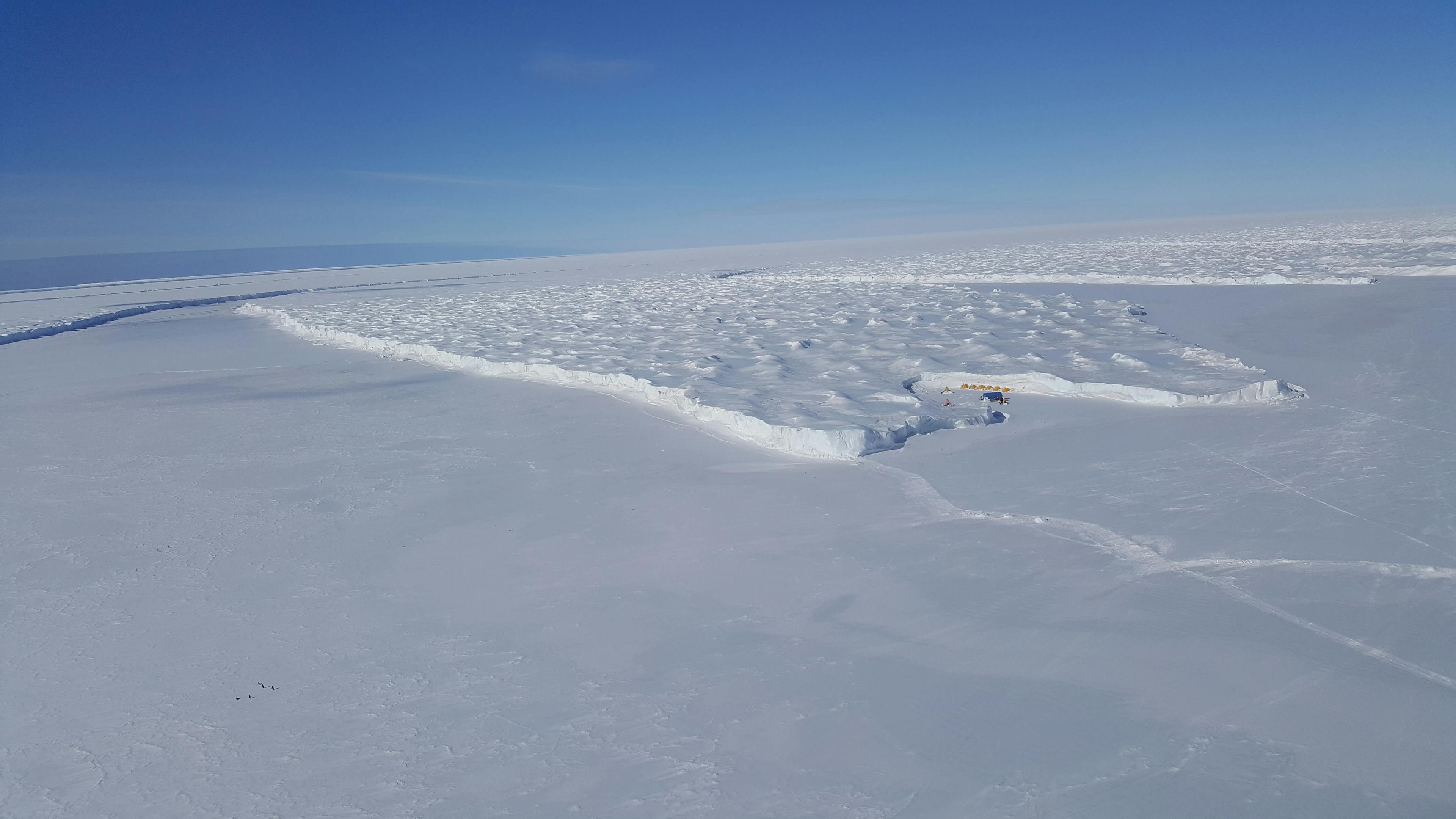 The Ross Ice Shelf meets the smooth annual sea ice at Cape Crozier on Ross Island. The cliffs mark the seaward edge of the largest ice shelf in the world, about the size of France.