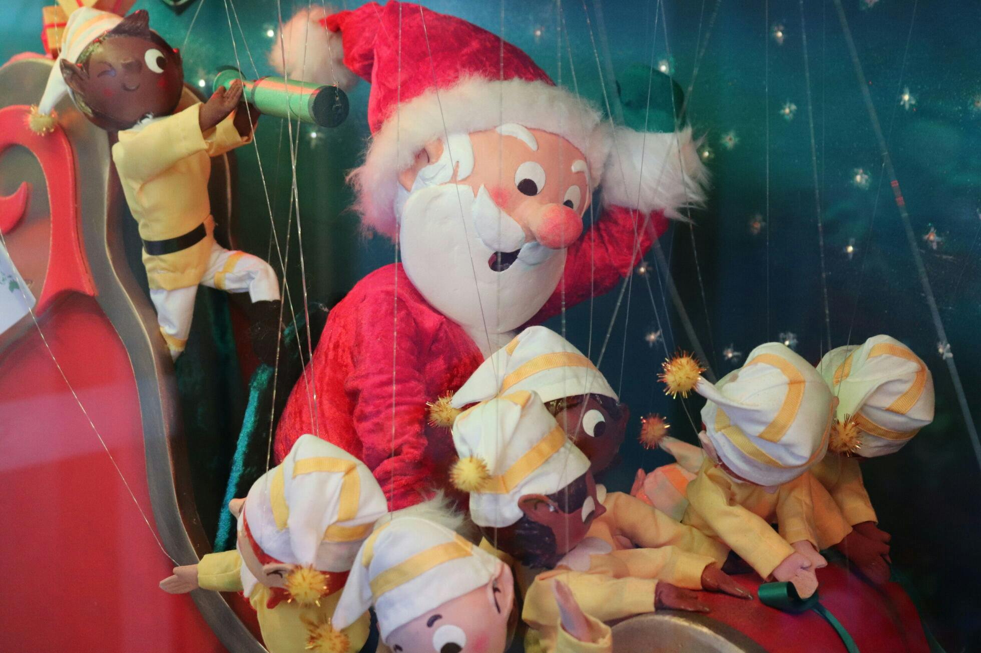 Elves in the window of Smith and Caughey's Christmas display in 2023.