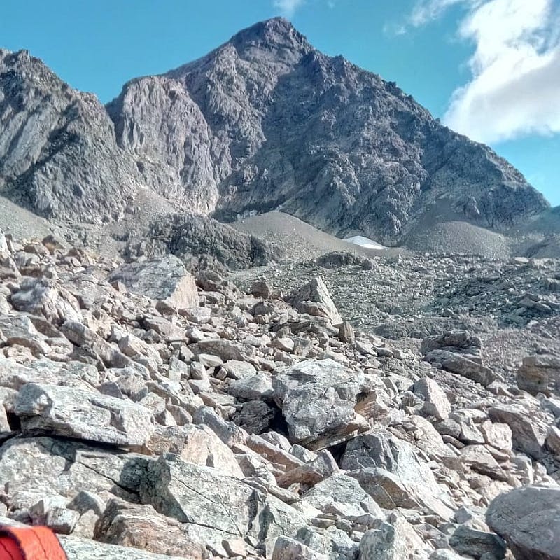 A view looking up to a high and sharp peak in Waiau Pass.