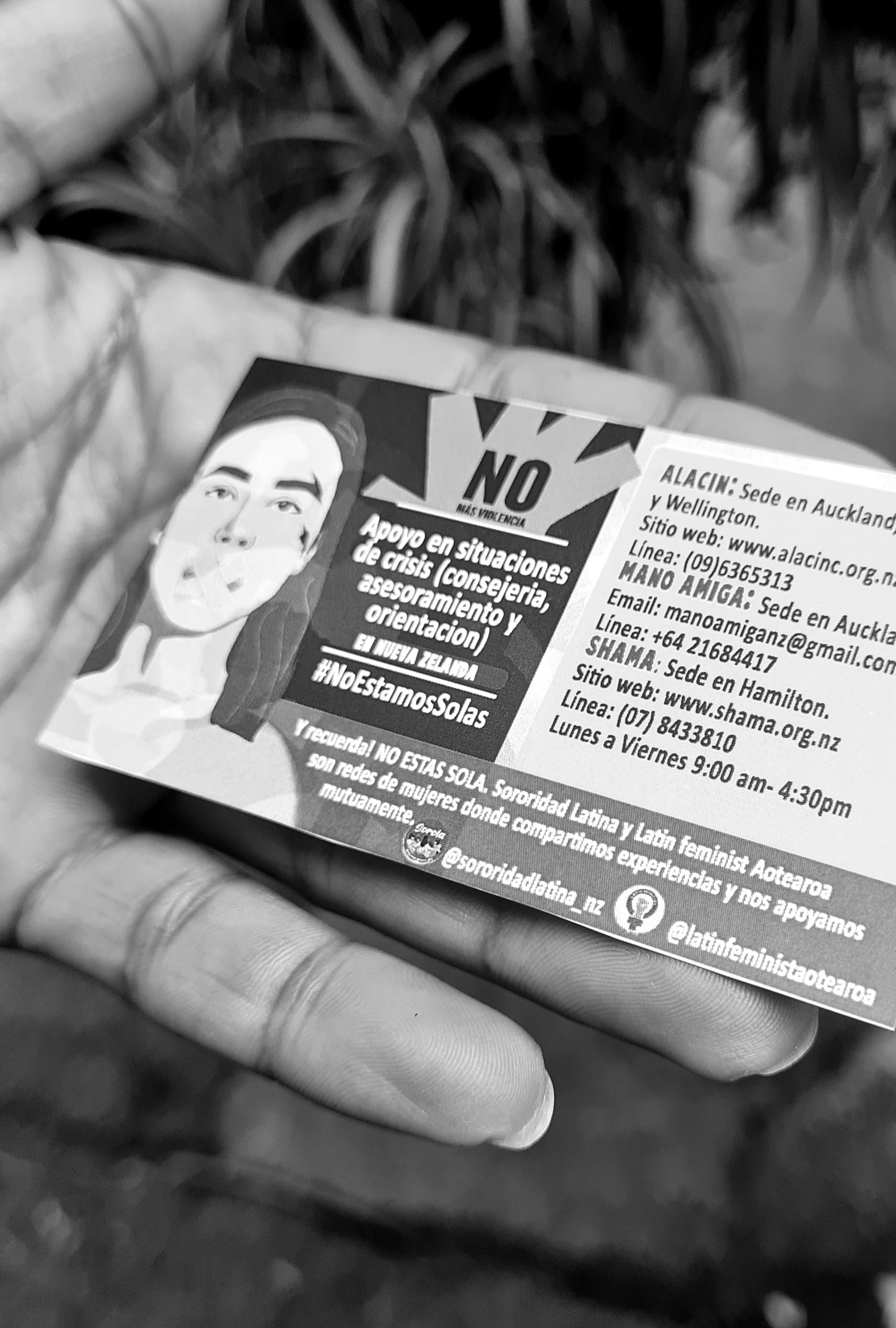 Cards with helplines being distributed to mark International Day for Elimination of Violence against Women in Auckland.