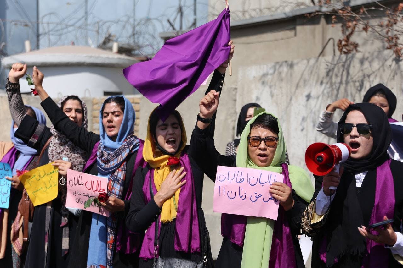 A group of women stage a rally calling on the Taliban to ensure equal rights in the country and allow them to be contributing members of Afghan society, in Kabul.