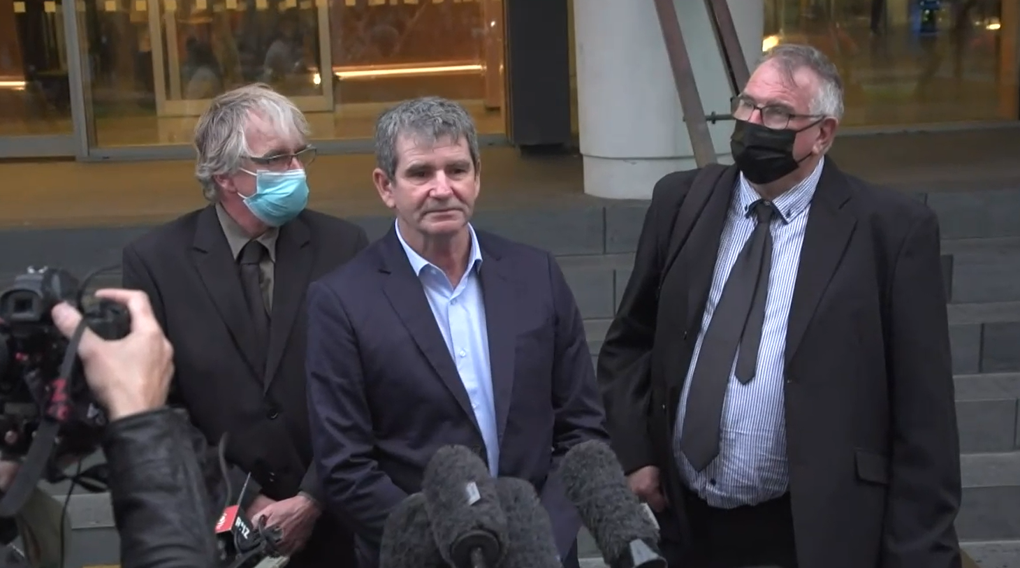 Alan Hall's brothers Greg, Geoff and Robert speak outside the Supreme Court.