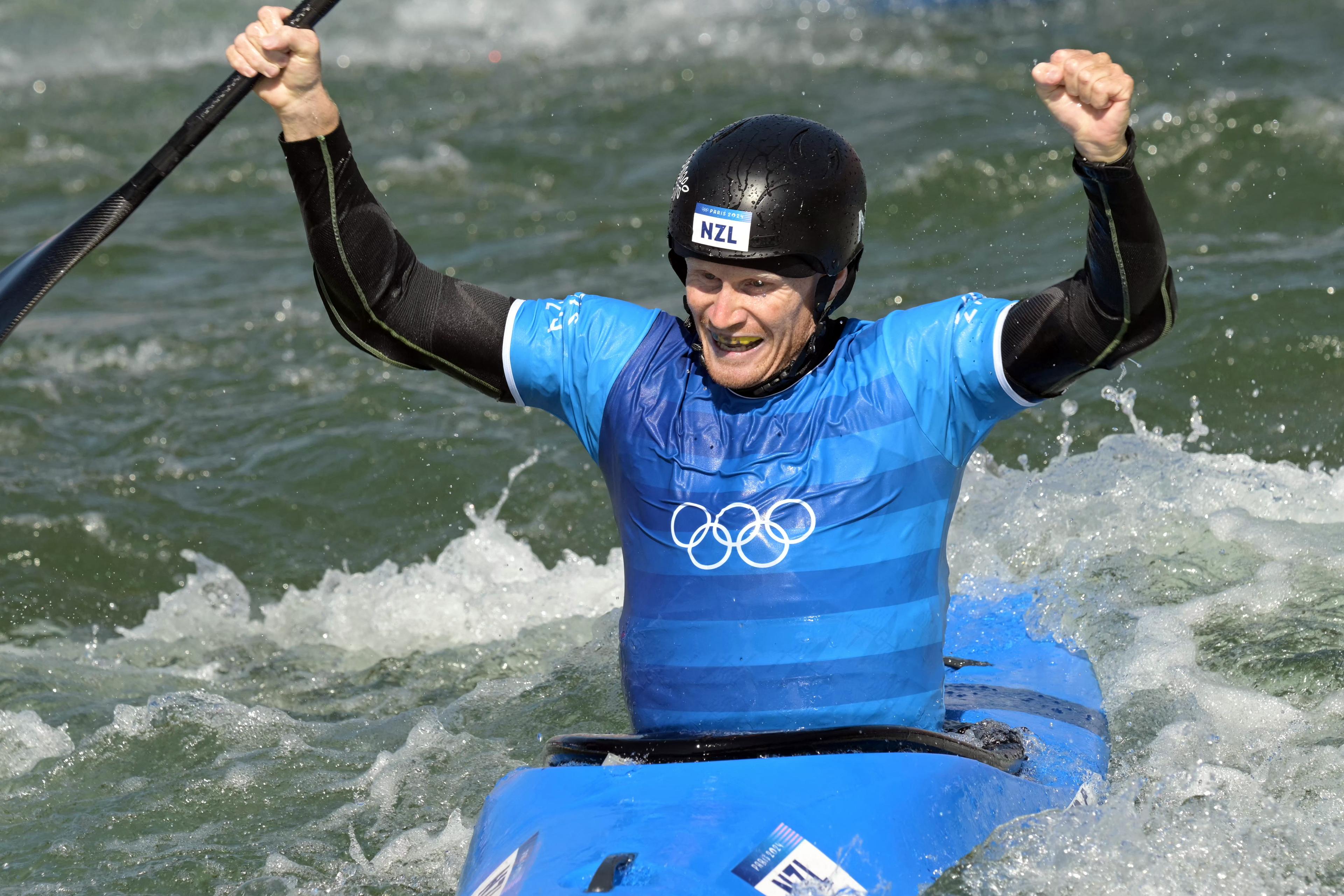 New Zealand's Finn Butcher celebrates winning in the men's kayak cross final of the canoe slalom competition at Vaires-sur-Marne Nautical Stadium in Vaires-sur-Marne during the Paris 2024 Olympic Games on August 5, 2024. (Photo by Bertrand GUAY / AFP)