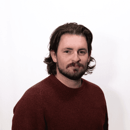 Head shot of Ben Strang, host of the Paris Essentials Podcast