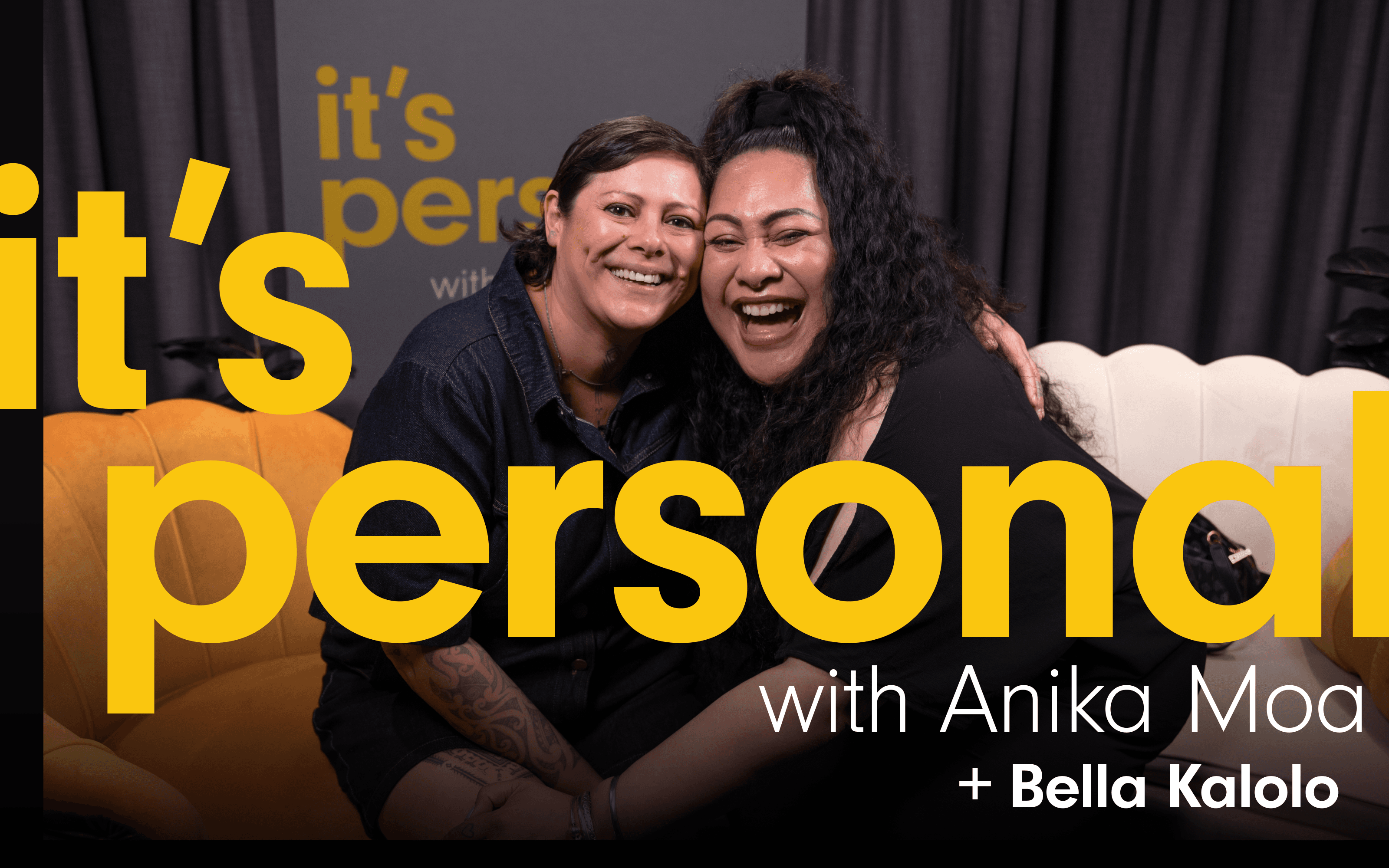 Photo of Anika Moa and guest smiling. They are sitting on the couches where the interview takes place. The podcast title ‘It’s Personal with Anika Moa ’ Is written Plus the guest’s name,