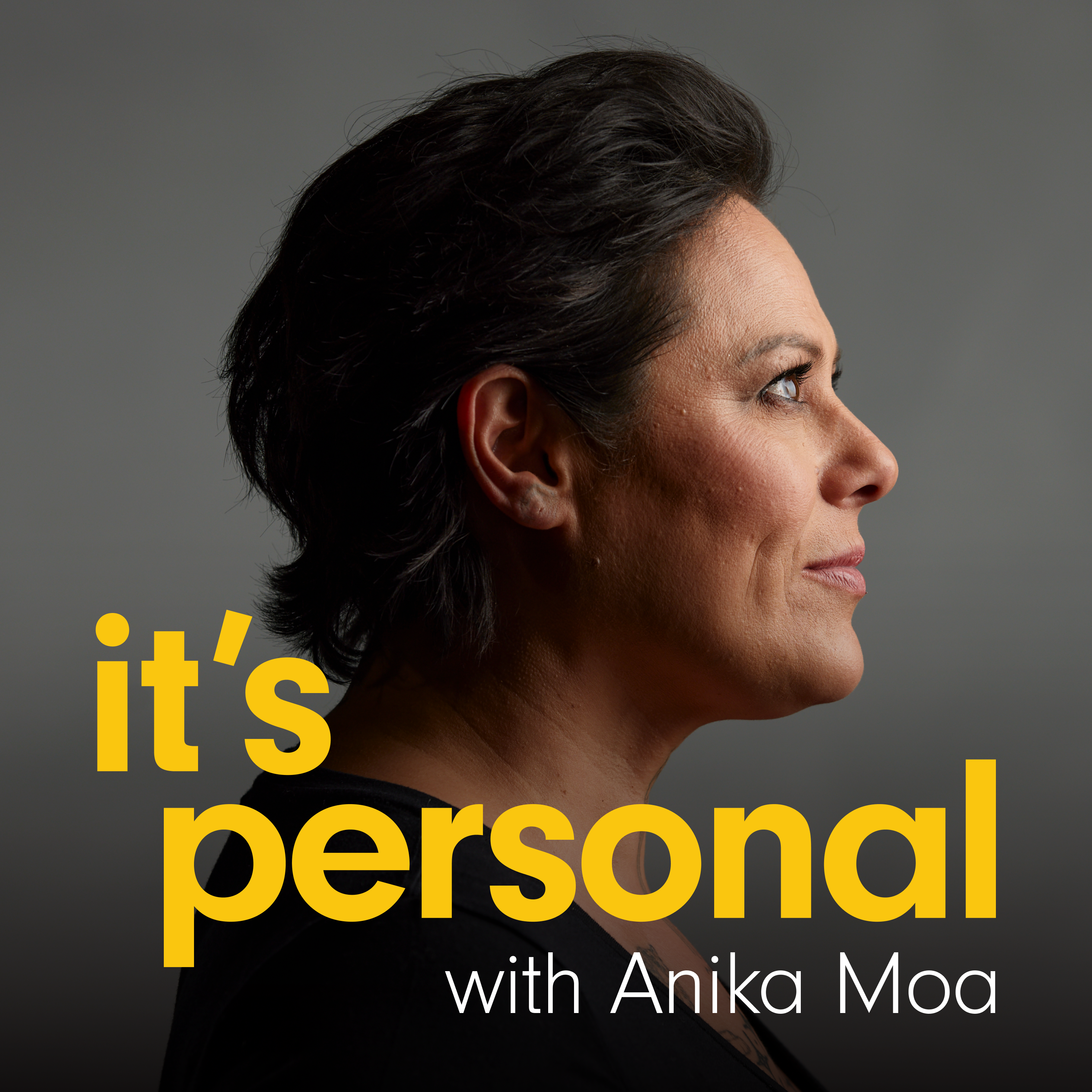 A side on head-and-shoulders photo of Anika Moa on a dark grey background. The podcast title ‘Its Personal’ Is written over top in bright yellow and ‘with Anika Moa’ in white underneath.