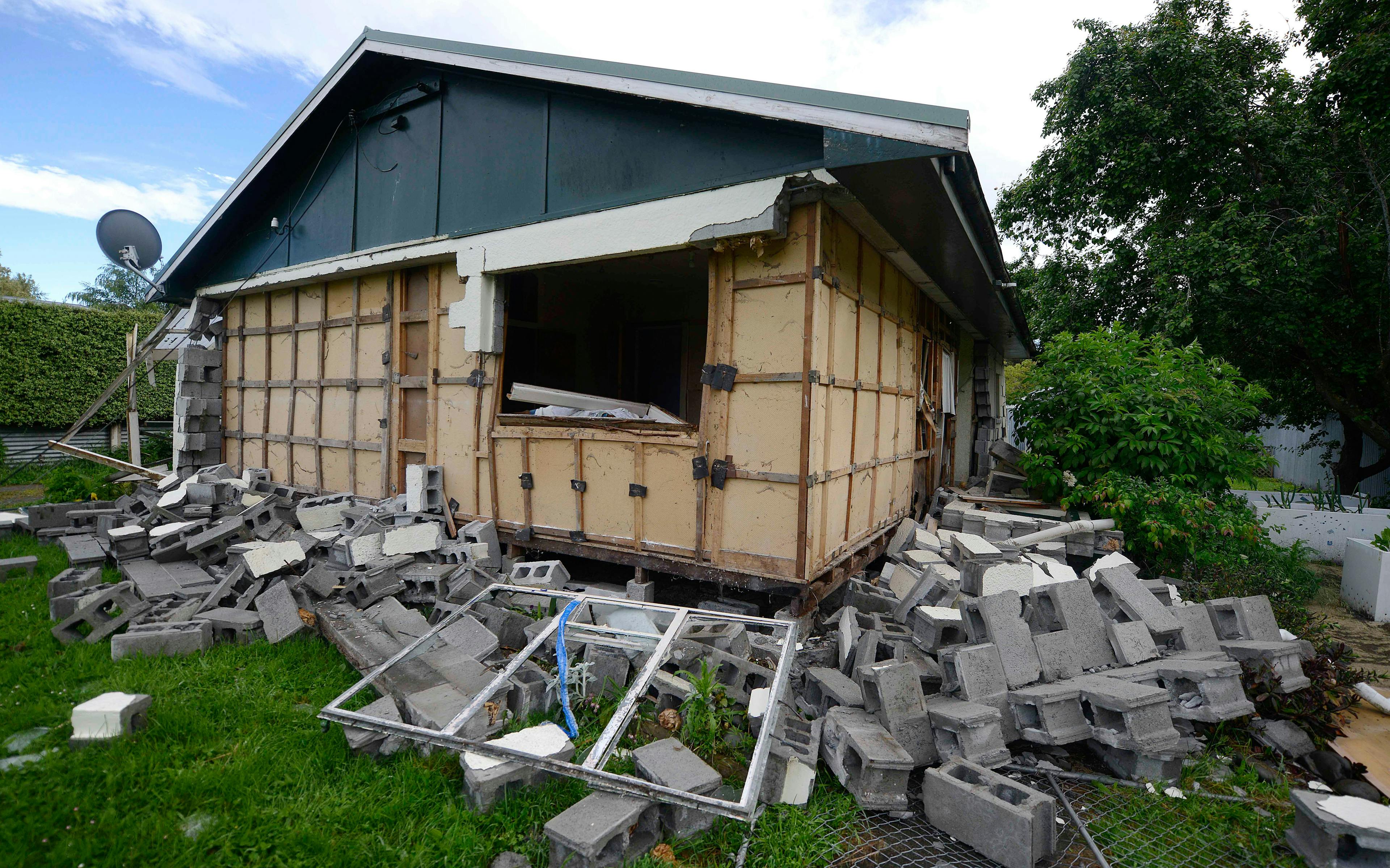 Damage to a house is seen in Waiau town, some 80 kms to the south of Kaikoura, on November 16, 2016, after an earthquake hit New Zealand on Monday.