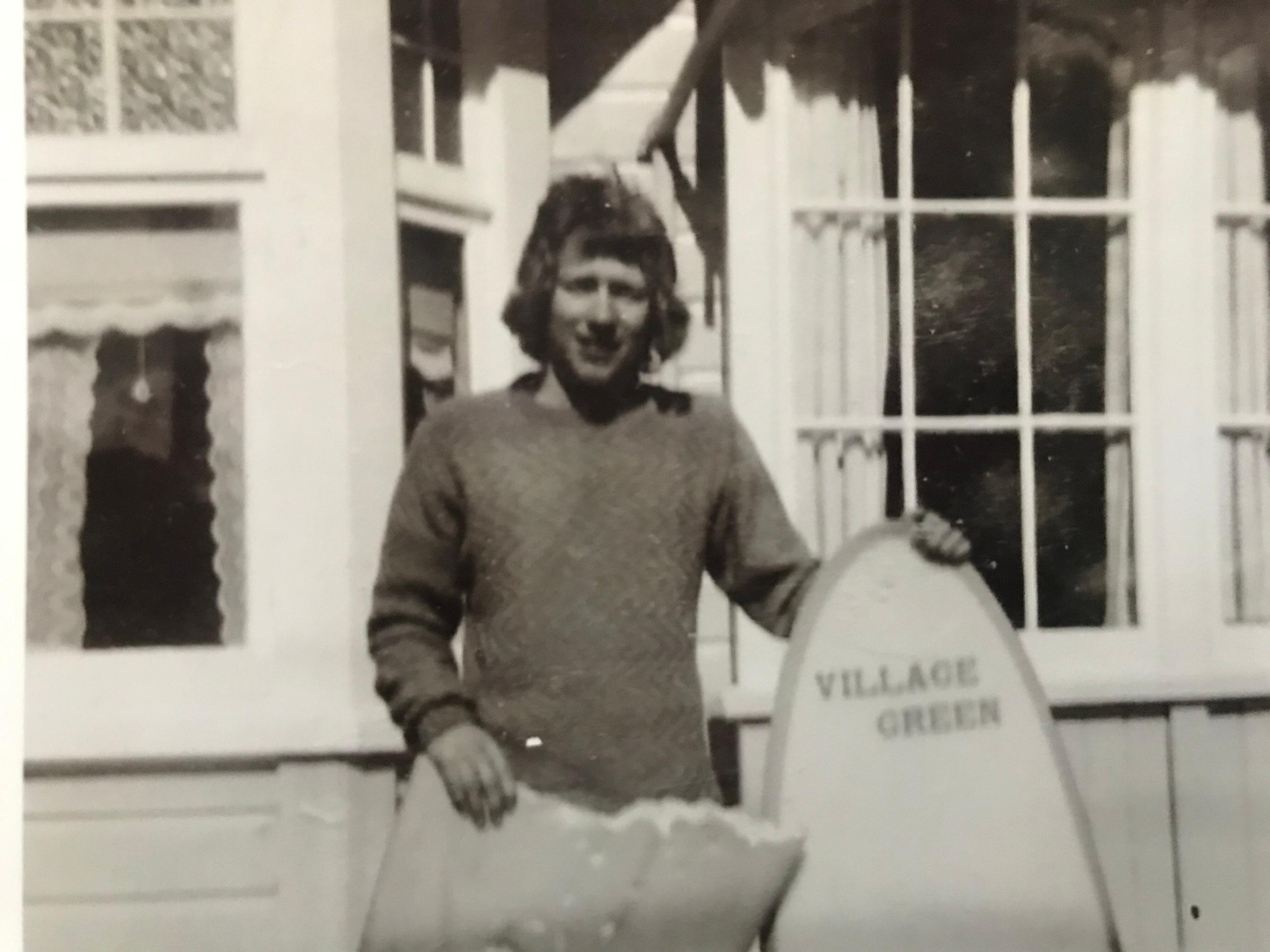 Barry Watkins pictured with his broken surfboard after the shark attack