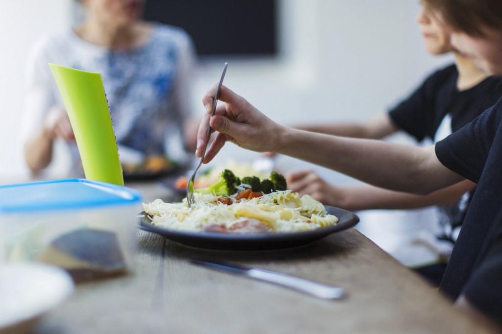 Close up family eating at dining table. (Photo by Paul Bradbury/Caia image/SCIENCE / NEW / Science Photo Library via AFP)