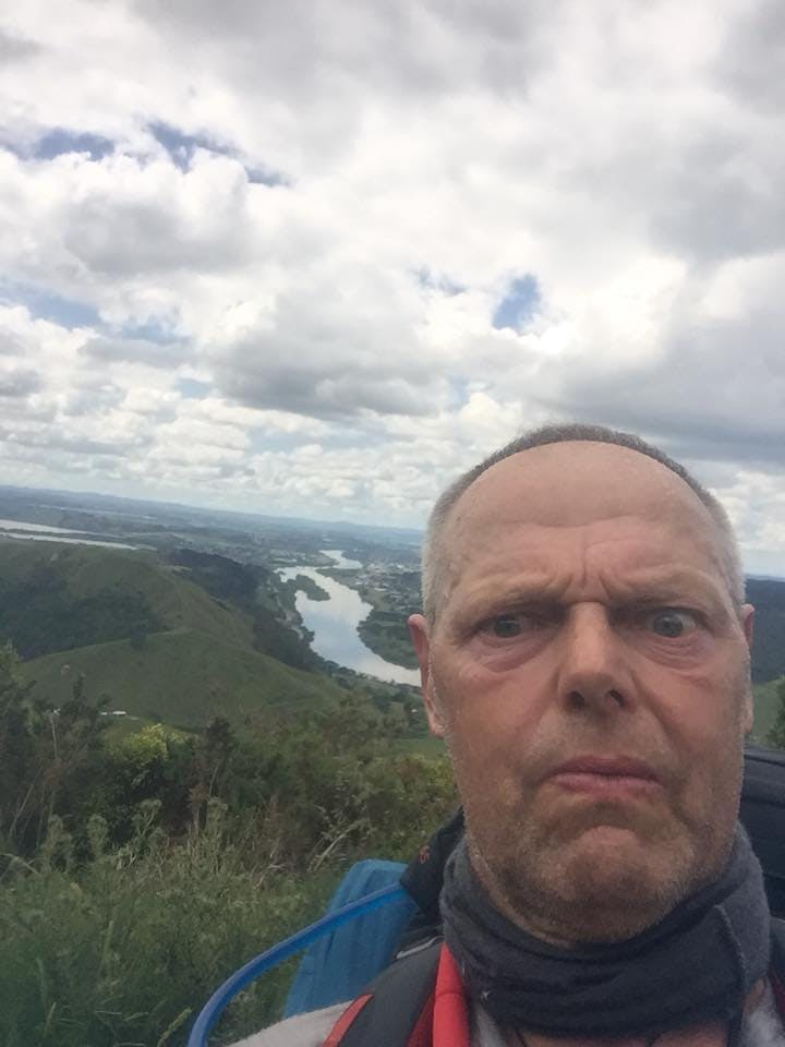 Bruce pulls a face as he poses in front of the Waikato river.