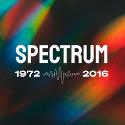 Red, blue, orange, green and yellow fractions of light are framed on the upper left and bottom right corners with a dark section on the other diagonal across the middle. The text 'Spectrum' is in bold and white, with the year numbers '1972' and '2016' underneath with a radio waveform in between the two numbers.