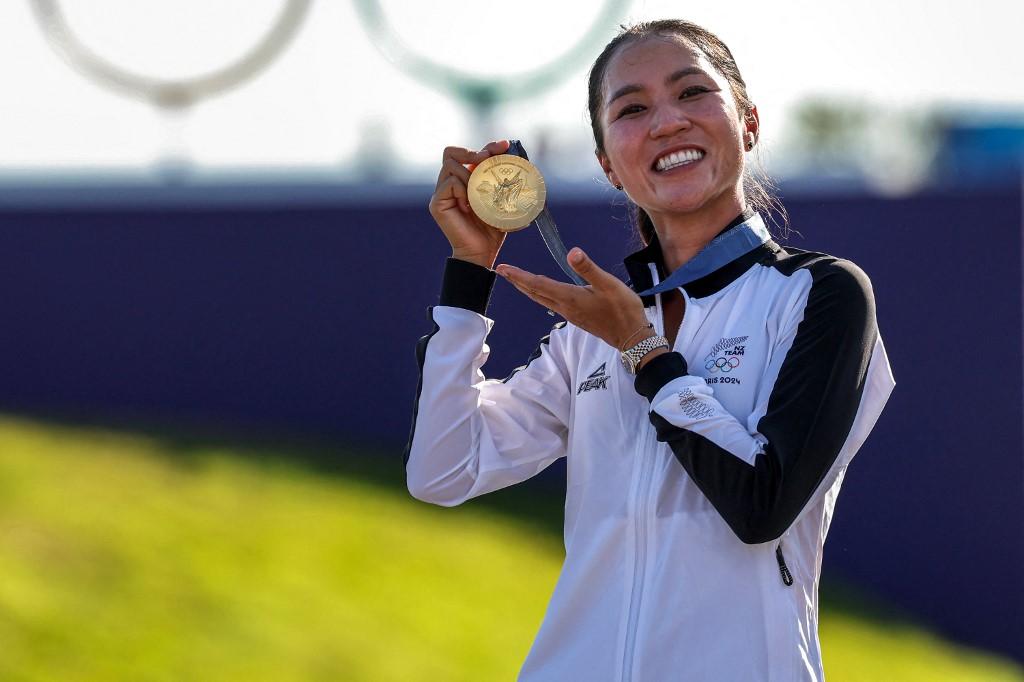 New Zealand's gold medallist Lydia Ko celebrates  on the podium after the women's golf event at the Paris Olympics.