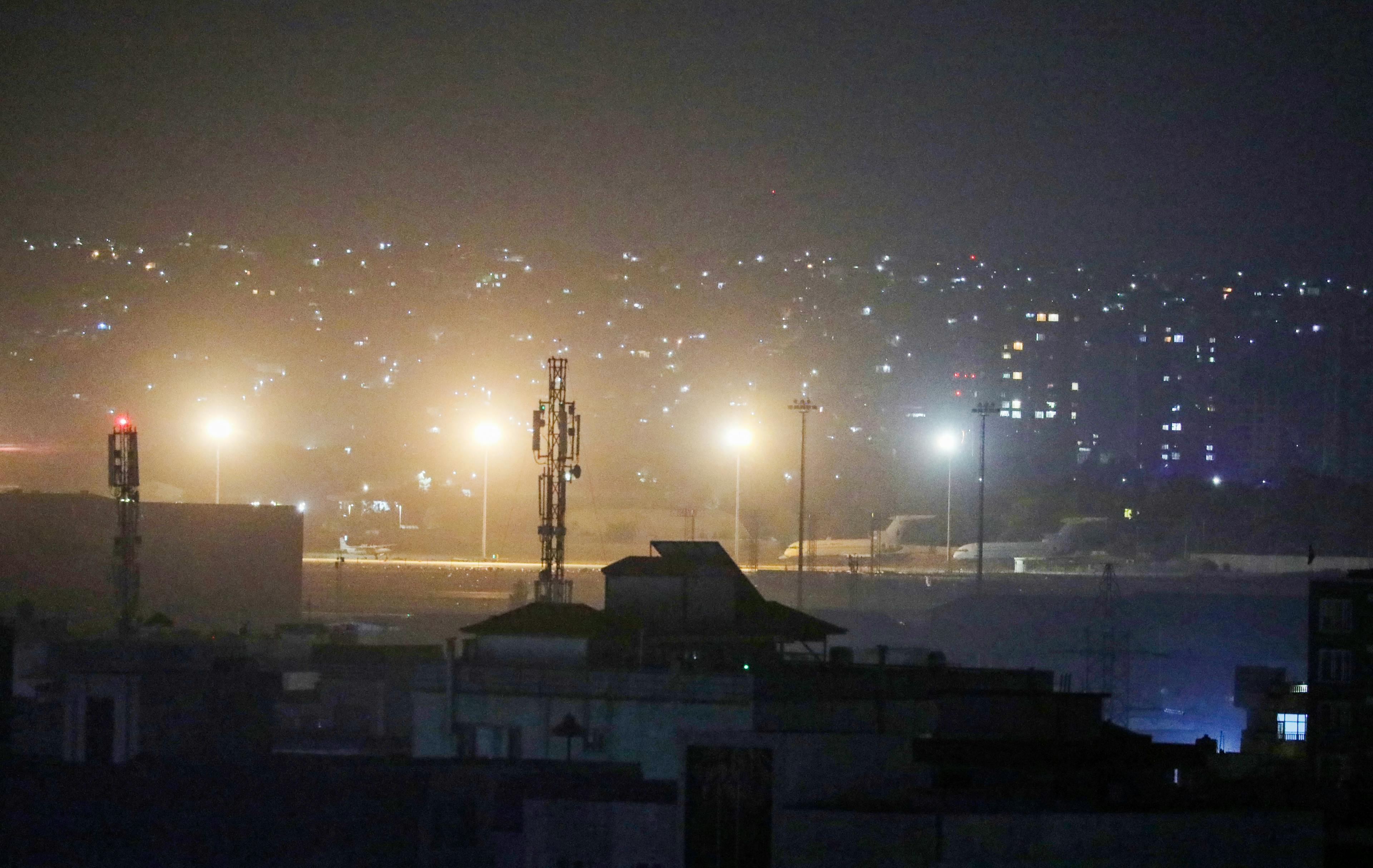 Planes are seen on the tarmac at the airport in Kabul late on August 30, 2021, hours ahead of a US deadline to complete its frenzied withdrawal from Afghanistan.