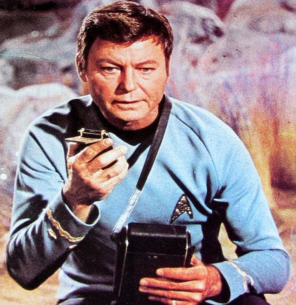 'Bones' McCoy with tricorder on cover of Star Trek magazine 1977