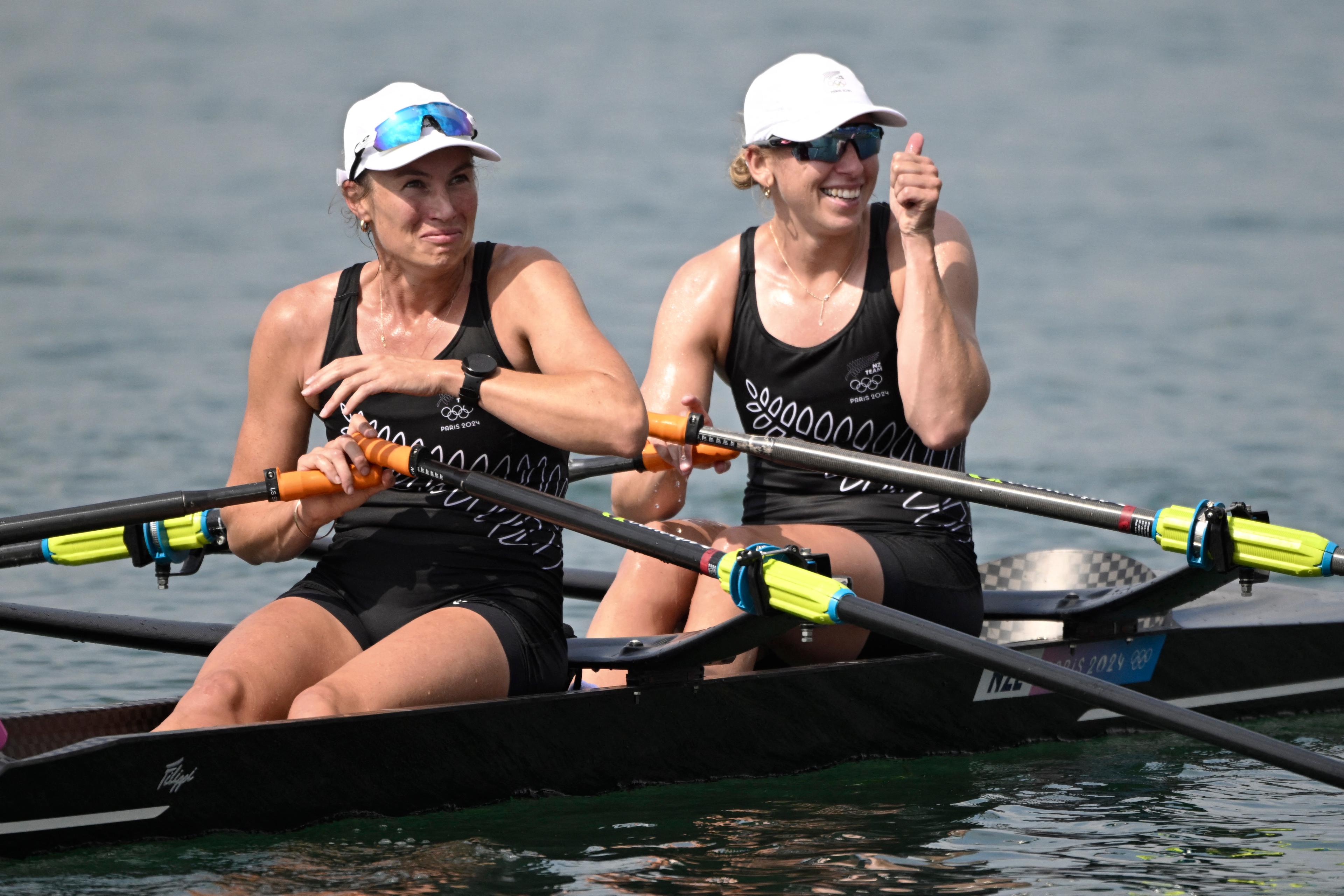 New Zealand's Brooke Francis (R) and New Zealand's Lucy Spoors celebrate winning in the women's double sculls final rowing competition at Vaires-sur-Marne Nautical Centre in Vaires-sur-Marne during the Paris 2024 Olympic Games on August 1, 2024. (Photo by Olivier MORIN / AFP)