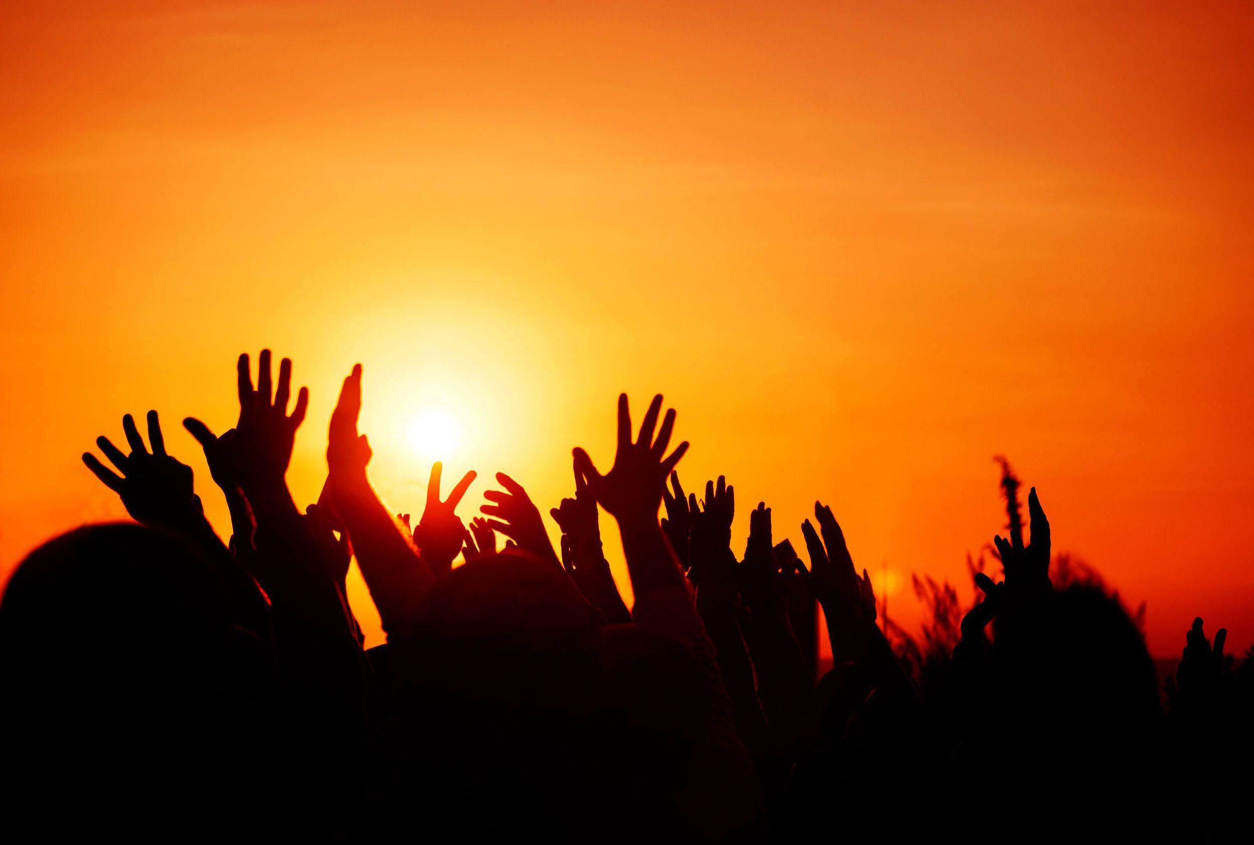 crowd with hands in the air